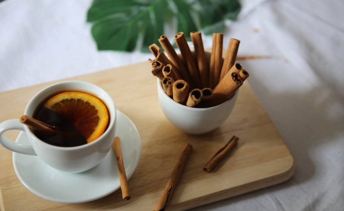 Tea with Orange Slice and Cinnamon Sticks